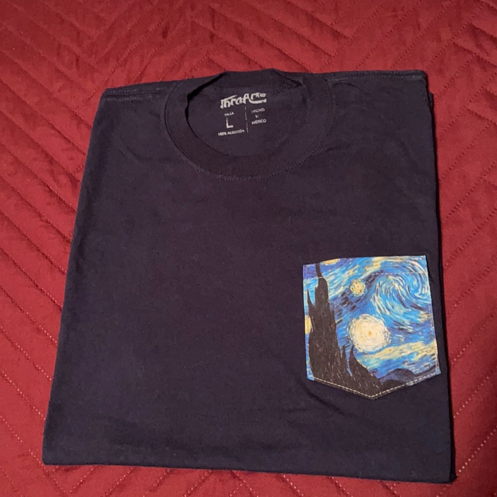 Navy blue T shirt, with Van Gogh scene on pocket.